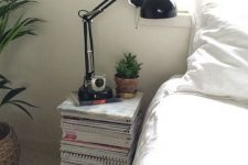 a unique and cool idea of a nightstand – a stack of magazines and books, is a very creative and very easy option to go for