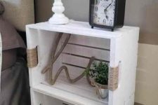 a white crate nightstand of two pieces stacked, of some twine and on casters is a creative rustic idea that works for relaxed bedrooms