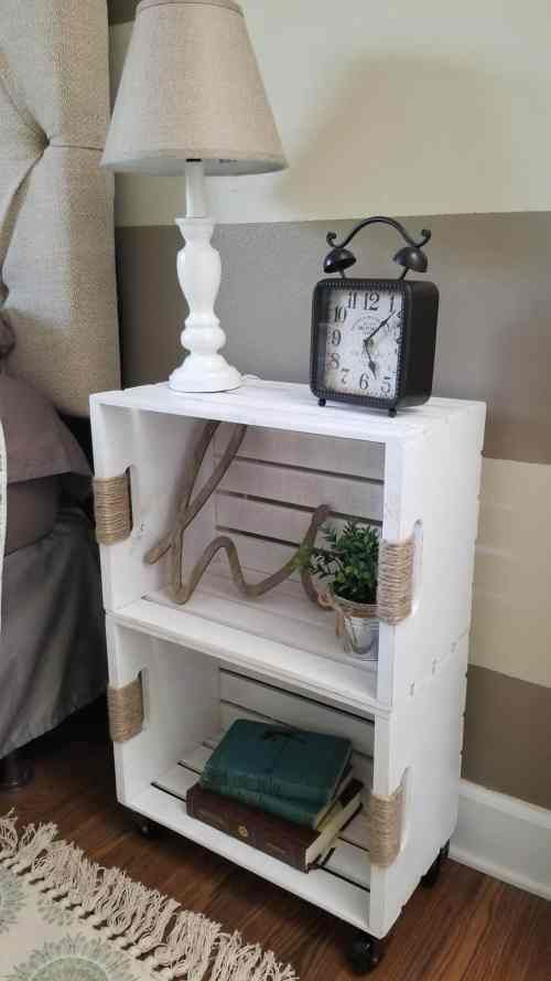 a white crate nightstand of two pieces stacked, of some twine and on casters is a creative rustic idea that works for relaxed bedrooms