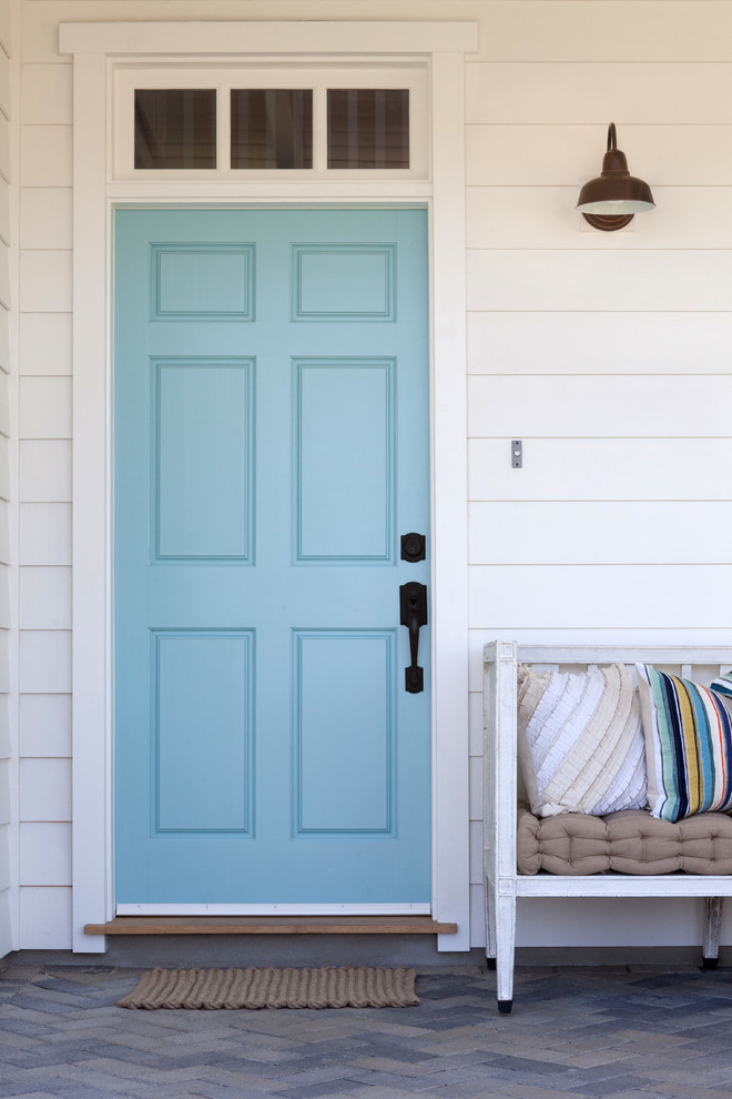 a simple bench and a barn light are only things you need on your porch (Kate Lester Interiors)