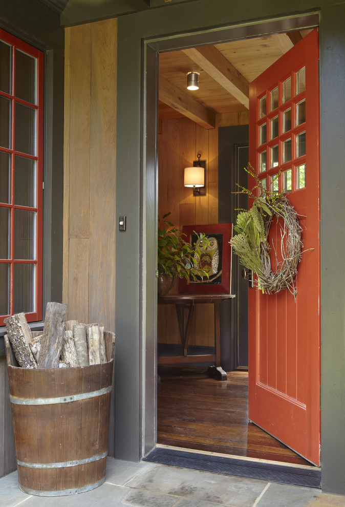if you like rustic style then a wooden bucket with some logs is a great piece of decor for your front porch (Jeffrey Dungan Architects)