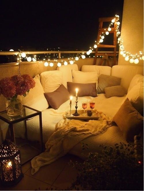 String up some lights to turn your balcony into a magical hideaway. A comfy daybed or a bunch of floor pillows would help to take the romance to the next level.