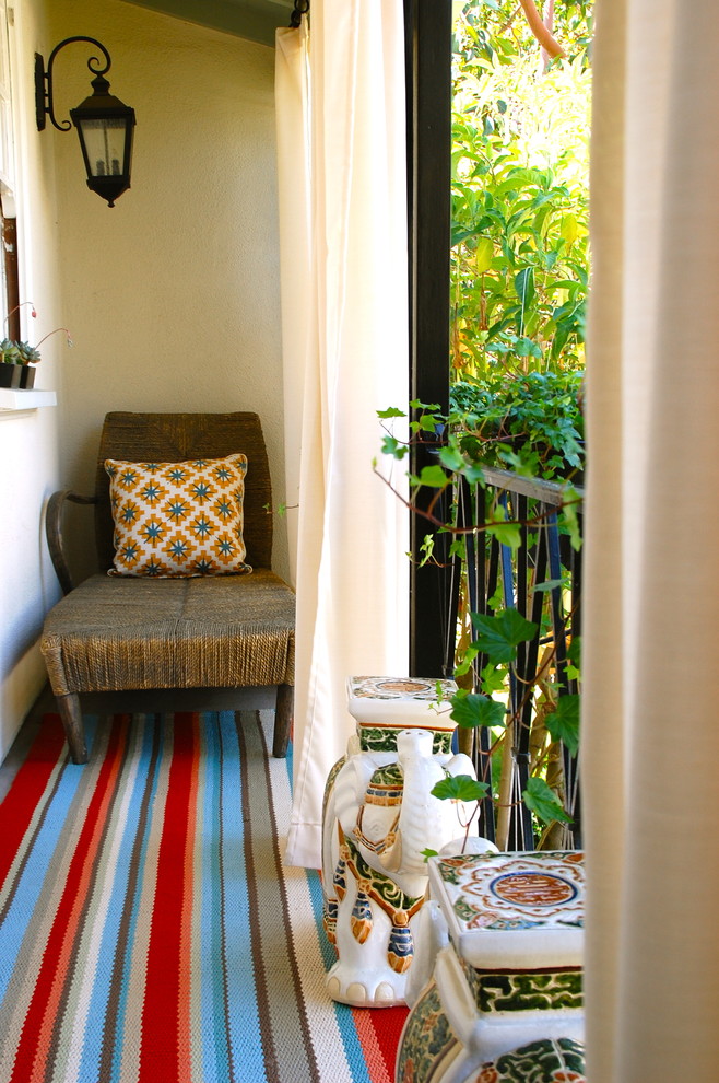 Stripe patterns could visually enlarge the space so a simple rug could change the look of a whole balcony.