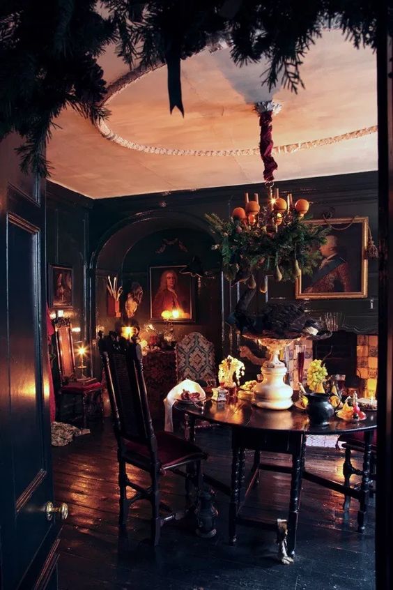 https://www.digsdigs.com/photos/2014/02/a-Gothic-dining-room-with-black-walls-and-a-floor-a-round-table-chairs-artworks-candles-and-a-fireplace.jpg