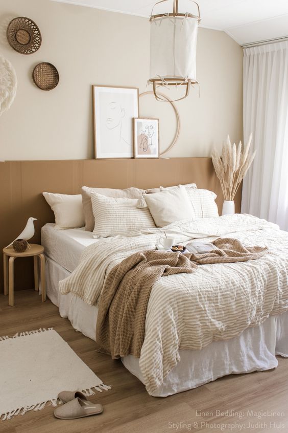 60 Relaxing Neutral Bedroom Designs - A Neutral Boho BeDroom With A Terracotta Accent A PenDant Lamp Woven Baskets LayereD BeDDing