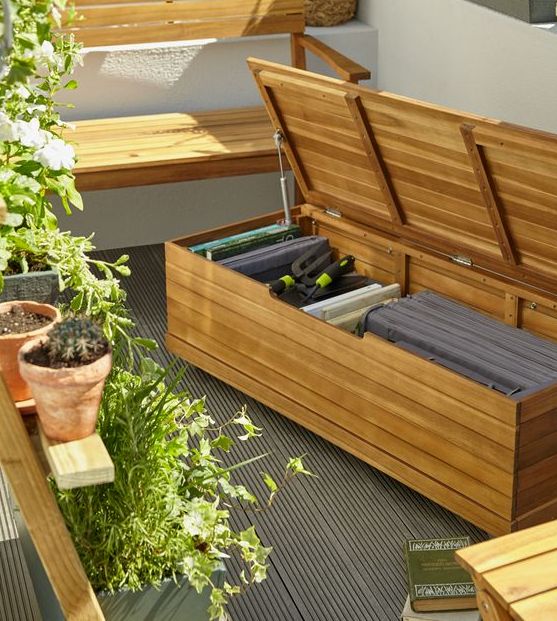 a simple wooden bench of planks may be used to store eveyrthing you want on your balcony