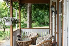 a small porch with rattan furniture