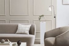 a stylish living room with wainscotting on a wall