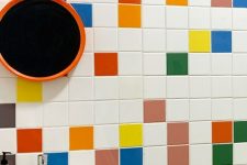 a bathroom spruced up with various colorful tiles is a fun and cool idea that will make your space feel very relaxed