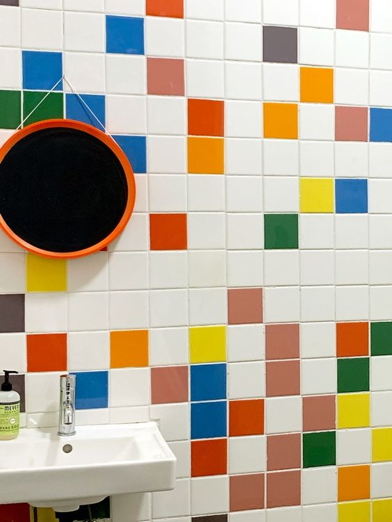a bathroom spruced up with various colorful tiles is a fun and cool idea that will make your space feel very relaxed