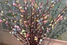 a bright arrangement with pastel and colorful willow in a jar with a bow is a quirky and whimsical idea