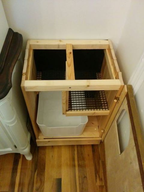 a hidden litter box with a de-littering cat walk is a simple and practical idea that will be appreciated by your cats