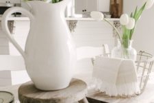 a white jug and a clear vase with some white tulips are nice spring decorations to rock, they will bring a casual feel to the space