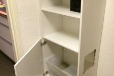 an IKEA hack – a Besta unit with a cat litter box inside and a comfortable entrance is cool and easy
