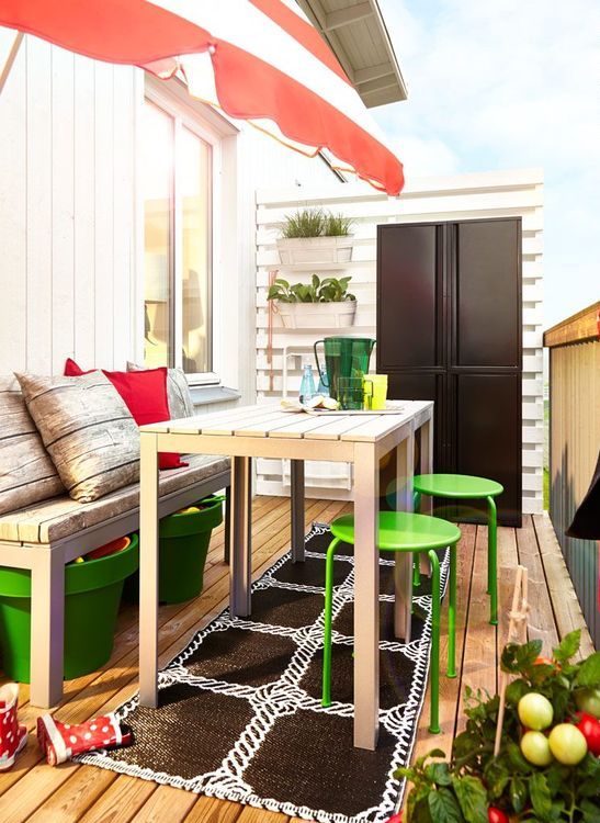 bright green planters for storage, matching stools, colorful barware and an umbrella for a spring or summer feel