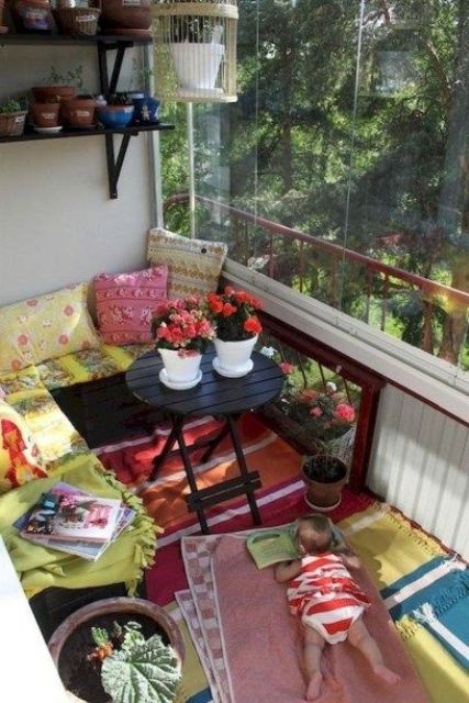 colorful printed textiles and blooms in pots will instantly change the look of the balcony