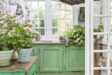 old kitchen cabinets placed in your garden shed will give you much storage space and countertops for garden works