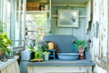 open shelves and tables with storage shelves are efficient and enough for a small garden shed