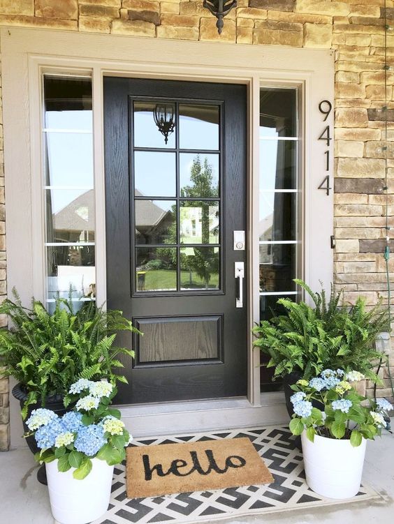 potted ferns and bright blue hydrangeas in pots will refresh your front porch for spring