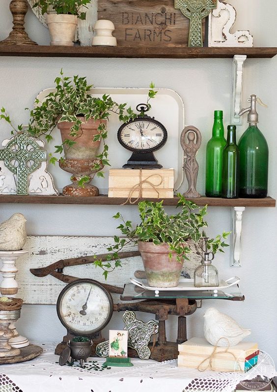 potted greenery, green bottles, green crosses for a slight spring touch in the space