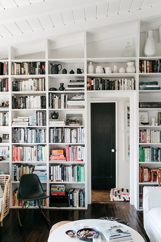 use the wall with your doorway to build in some bookshelves and to make the use of it