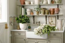 vintage kitchen cabinets used ina  garden shed for storage and for garden works, plus open shelves
