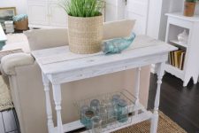 a delicate vintage whitewashed console table will match a vintage farmhouse or shabby chic space and will make the space more refined