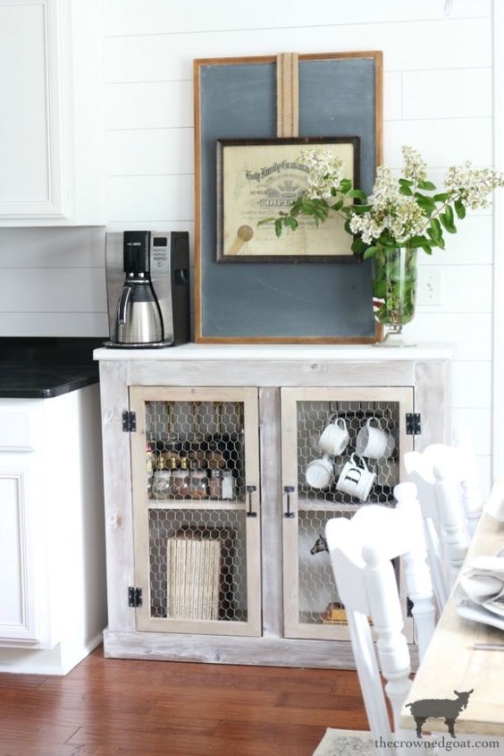 a farmhouse whitewashed cabinet with net doors is a lovely idea for a rustic space and you can DIY it easily