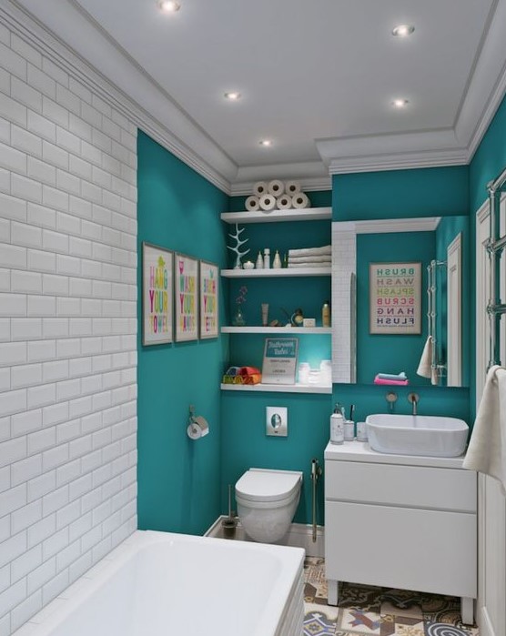a modern small bathroom with turquoise walls and white subway tiles plus white appliances for a contrast