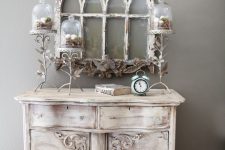 a vintage whitewashed sideboard with a very refined design is a chic idea for a shabby chic space and it looks amazing