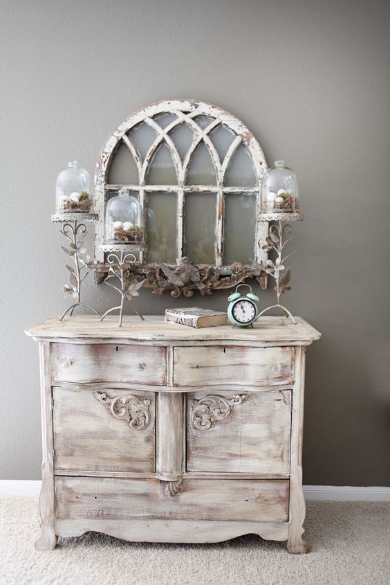 a vintage whitewashed sideboard with a very refined design is a chic idea for a shabby chic space and it looks amazing