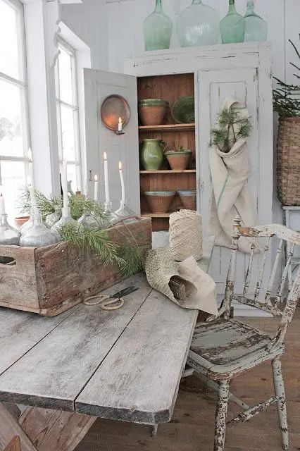 a whitewashed planked storage unit with shelves and decor is a lovely idea for a Scandi space or for a shabby chic one