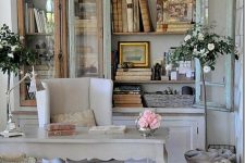 an oversized whitewashed bookcase with glass doors is a fantastic idea for a refined shabby chic home office