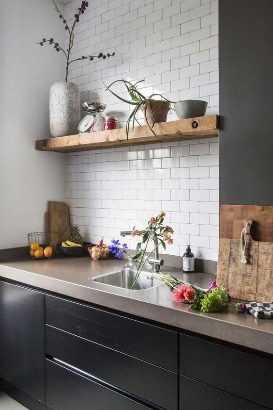 Black kitchen cabinets with concrete countertops store