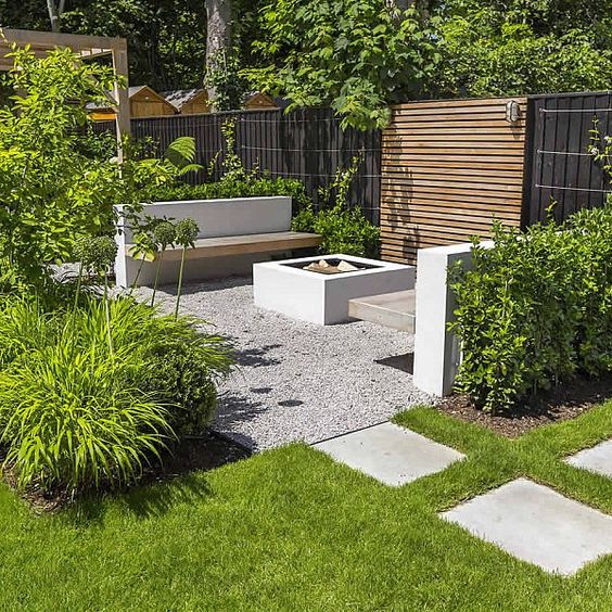 a minimalist townhouse garden with a lawn, pebbles, tiles, minimalist furniture, much greenery all around