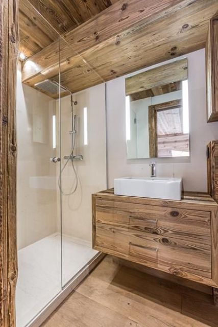 a small and modern chalet bedroom clad with chic wood, with white stone as a pair is an ultimate space