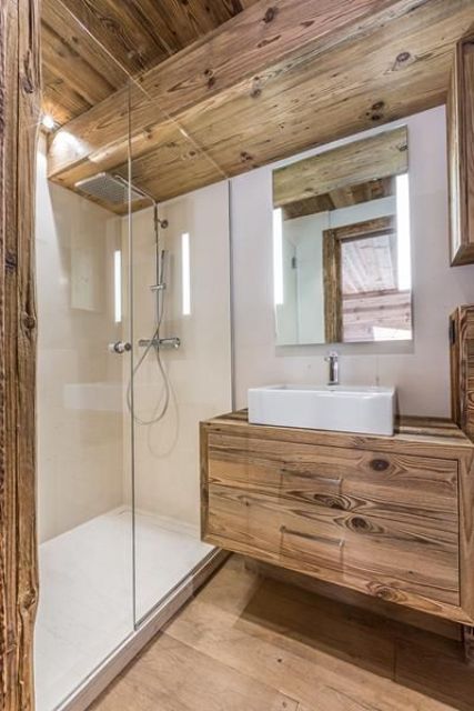 a small and modern chalet bedroom clad with chic wood, with white stone as a pair is an ultimate space