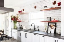a white farmhouse kitchen with concrete countertops, black handles and appliances is very cool