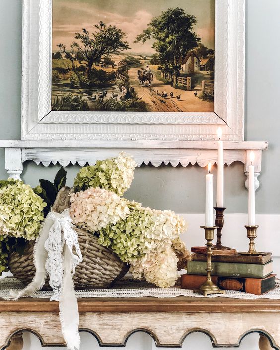 a basket with neutral hydrangeas and lace bows is a cool rustic decoration for any indoor or outdoor space
