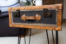 a chic and stylish vintage side table made of a vintage suitcase placed on hairpin legs is a lovely idea to rock