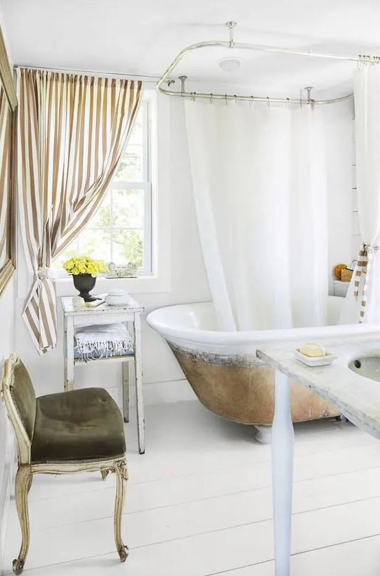  افكار ديكورات حمام فينتج انيقة وفخمة  A-fancy-bathroom-with-white-planked-walls-and-a-floor-a-vintage-bathtub-vintage-and-refined-furniture-a-striped-curtain-looks-wow