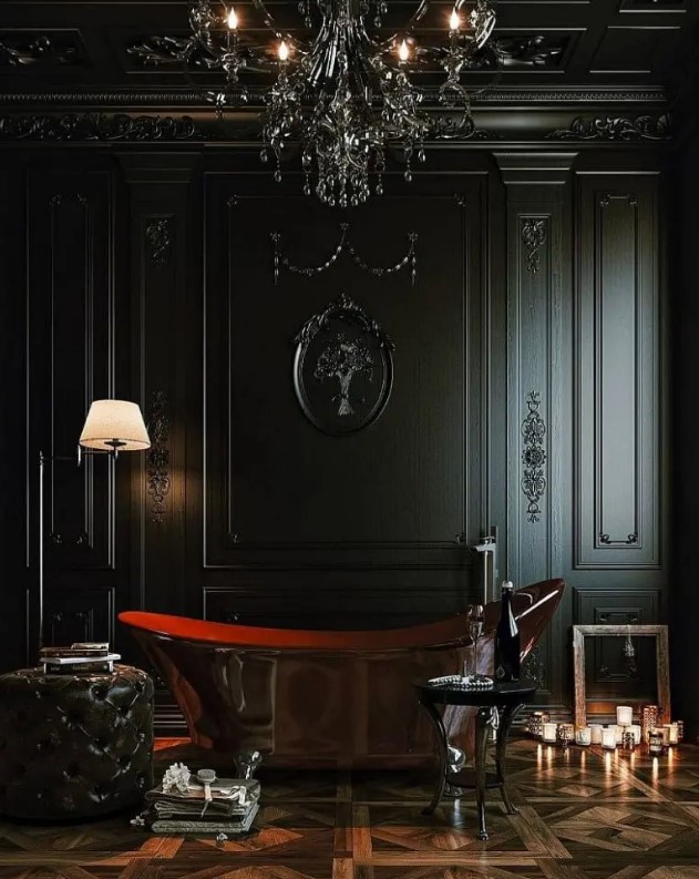 a fantastic Gothic bathroom with black molding on the walls, a polished metal tub, a parquet floor, black refined furniture, a black chandelier