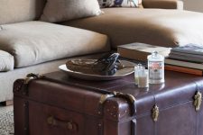 a leather vintage suitcase as a coffee table with a lot of storage and a very chic and bold look