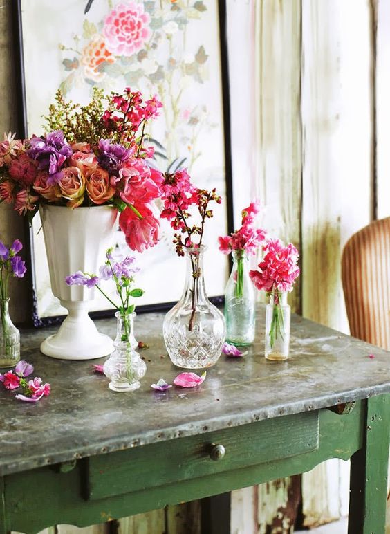 elegant and refined vintage crystal and porcelain vases with super bright blooms for summer home decor