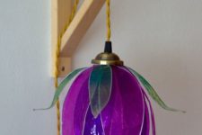 a bright purple flower-shaped pendant lamp will bring much color and a strong natural feel to your space