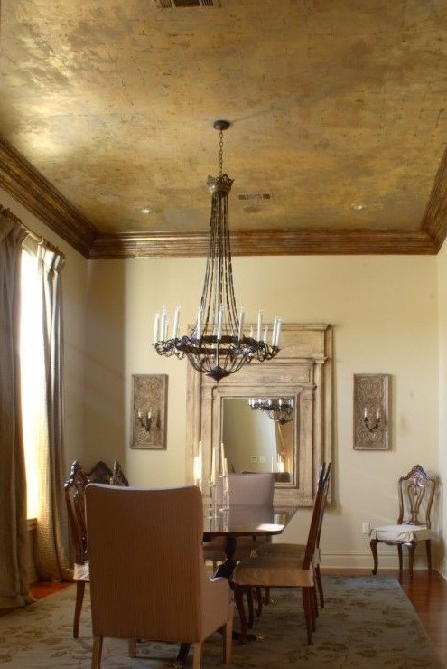 a gold metal ceiling with a rough feel and framing is a gorgeous way to accent a vintage space
