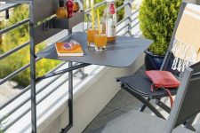 a little and functional metal railing hanging piece can be used for planters, for food and drinks and even for working on a small laptop