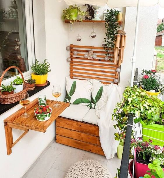 a little wooden wall mounted table, a shelf and planters hanging on the railing are all great for small and tiny balconies