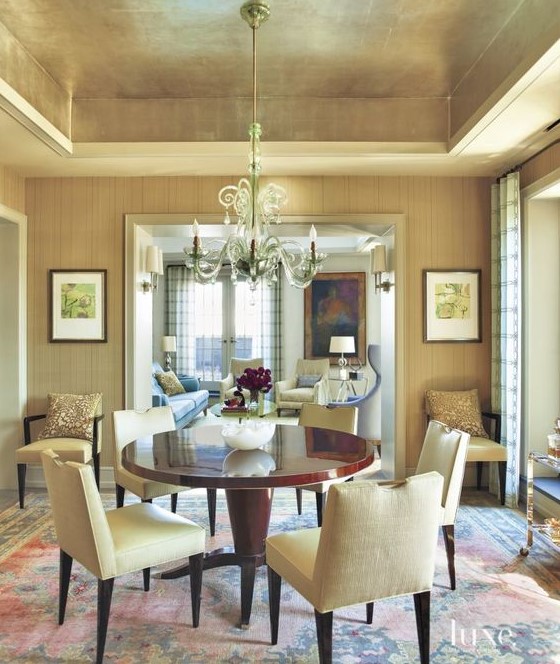 a neutral contemporary living room spruced up with a gold ceiling that adds shine to your space