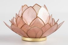 a pink lotus-inspired table lamp with a gold edge is very chic and very refined, it will give a natural feel to your space